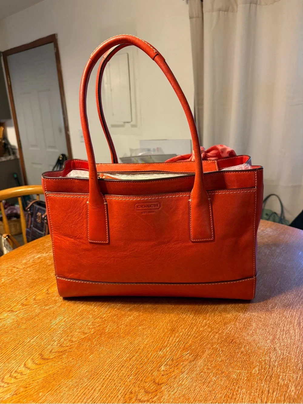 Coach Orange Leather Shoulder Bag with Pink Scarf Accent